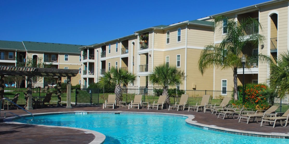 Two employees standing in front of their coffee shop